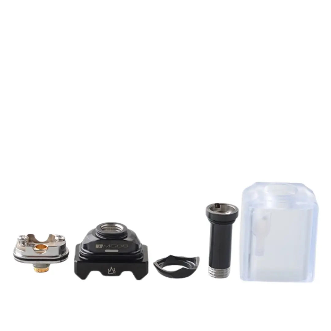 The image showcases the disassembled components of the 5Avape Monarchy IMobb Style RBA. From left to right, it includes the RBA deck, base platform with engraved branding, chimney piece, supporting ring, and frosted outer tank shell. These parts highlight the modular design, allowing vapers to customise and build their setups efficiently. Perfect for experienced users seeking a tailored vaping experience.