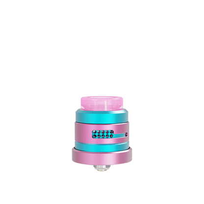 Damn Vape Nitrous RDA Dual Cap Edition in pink and teal, displayed on a white background.