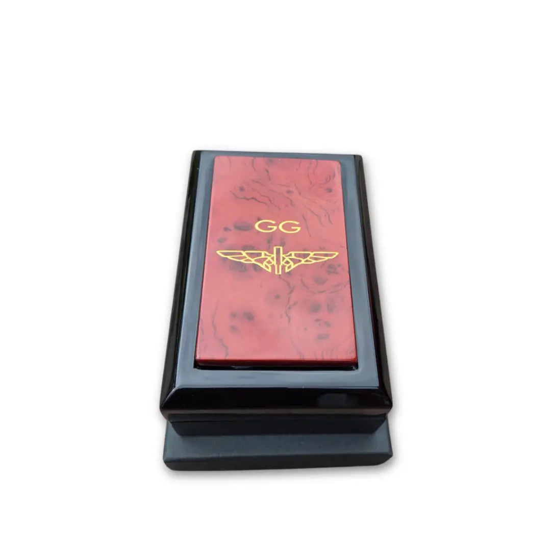 Golden Greek black box with red top featuring a logo and 'GG' text on a white background