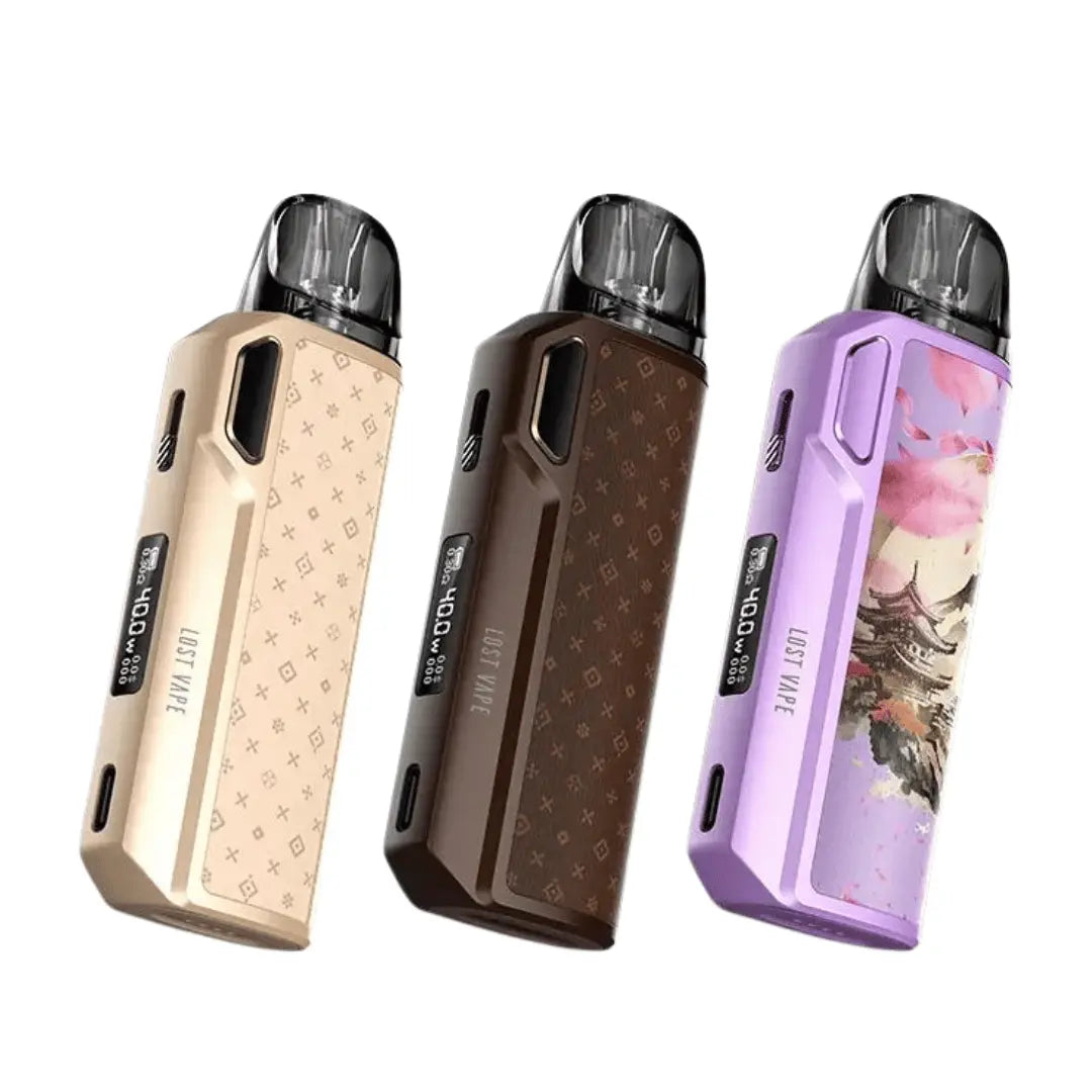 Three Lost Vape Thelema Elite 40 Pod Kits in beige, brown, and purple luxe designs.
